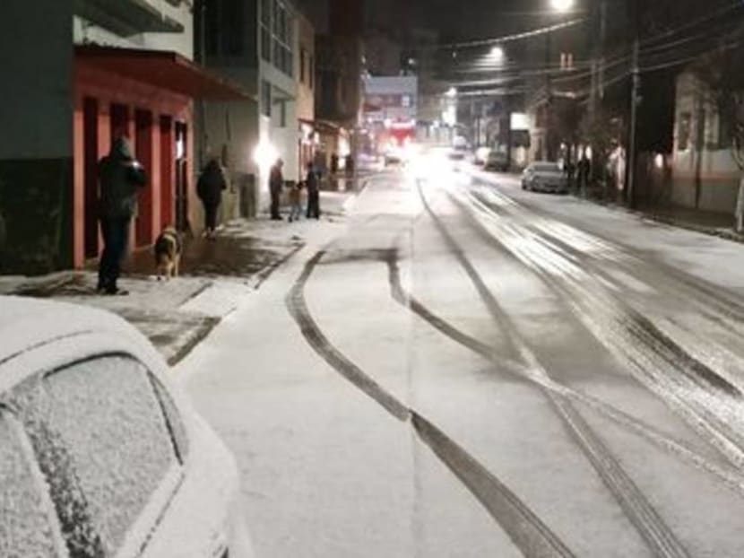 Seeing snow for the first time at 62: Brazilians revel in icy snap