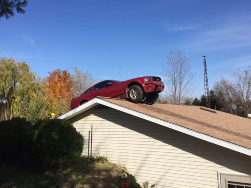Owner hears ‘kaboom’, finds car on roof of US home