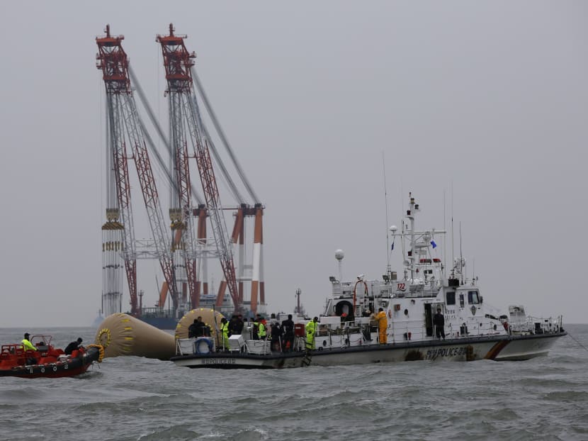 Gallery: Bodies seen trapped in sunken Korean ferry as hundreds remain missing