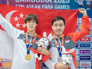 Colin Soon (left) and Wong Zhi Wei pose with their ASEAN Para Games medals at the Morodok Techo National Stadium in Phnom Penh on June 5, 2023.