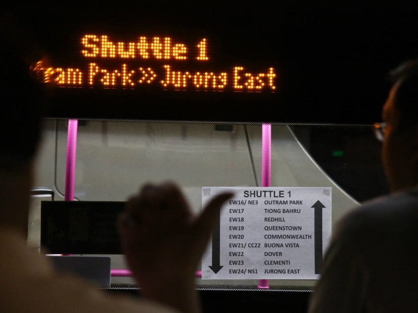 A sign displaying the route of travel for the pictured shuttle bus is seen plastered to the windscreen as commuters wait to board it at Outram Park MRT station, Dec 8, 2017. Photo: Nuria Ling/TODAY