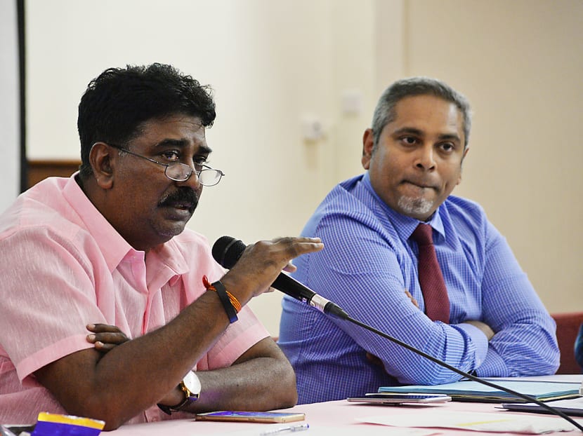 Mr R Vengadasalam (left) and Mr Alfred Dodwell, legal advisor to Mr Vengadasalam and his team, speaking to members of the Singapore football community. Photo: Robin Choo