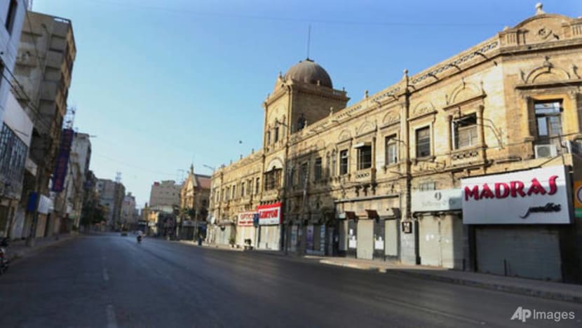 Gunmen wound Chinese factory workers in Pakistan's port city of Karachi Gunmen wound Chinese factory workers in Pakistan's port city of Karachi