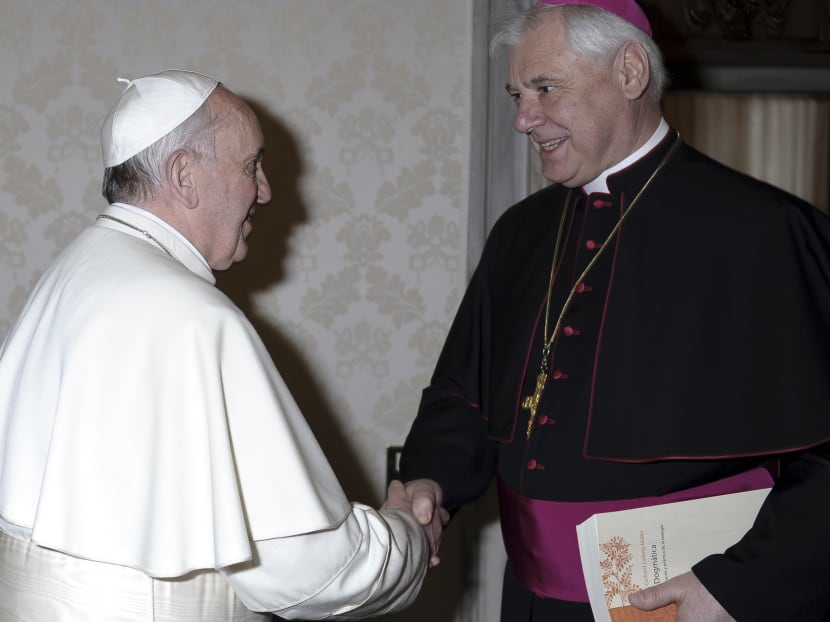 Pope Francis, left, meets with Bishop Gerhard Ludwig Mueller, Prefect of the Congregation for the Doctrine of the Faith, at the Vatican. Photo: AP