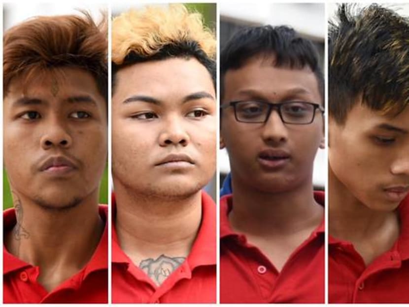 Five men who were charged for their involvement in a riot at Chua Chu Kang. From right: Syafiq Safari, Zahiruddin Ariffin Zilsham, Irman Shah Putera Roslan, Haikel Rahmat and Farhan Alias.