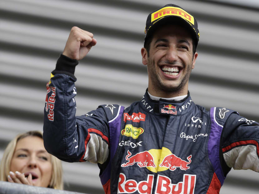 Red Bull driver Daniel Ricciardo of Australia celebrates on the podium after winning the Belgium Formula One Grand Prix at the Spa-Francorchamps circuit, Belgium, Aug 24, 2014. Photo: AP