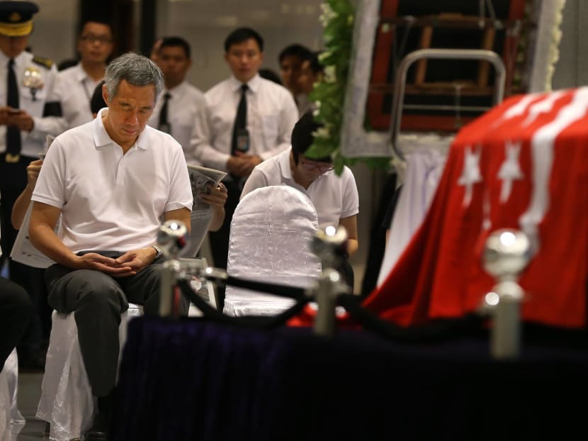 Prime Minister Lee Hsien Loong meditating at Parliament House in front of Mr Lee Kuan Yew’s casket before the State Funeral began yesterday. Photo: Facebook