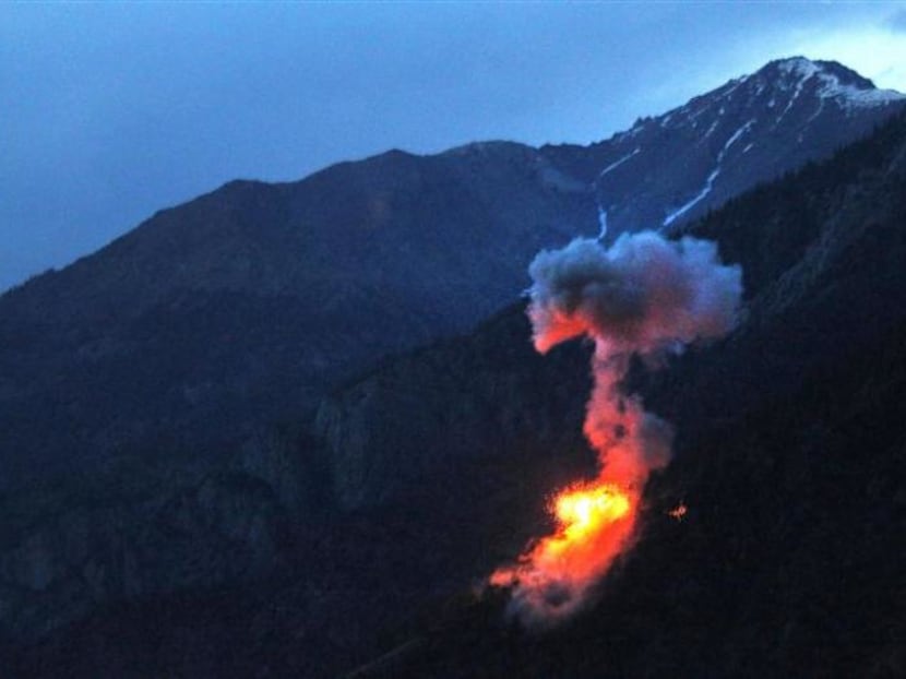 Two 500 pound bombs explode at dusk on a Taliban fighting position near Blocking Position one above Kamdesh in Afghanistan's Nuristan Province. Reuters file photo