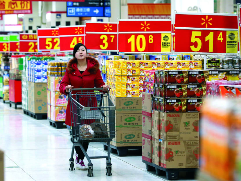 A shopper at a Walmart store in Beijing. The new data revolutionise the picture of the world’s economic landscape, boosting the importance of large middle-income countries. PHOTO: REUTERS