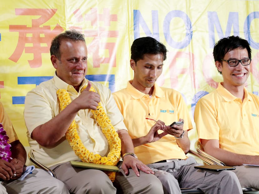Mr Kenneth Jeyaretnam with fellow Reform Party candidates Osman Sulaiman and Roy Ngerng at a rally yesterday. Mr Jeyaretnam said his party’s proposal to give cash handouts can be financed from the Net Investment Returns Contribution. Photo: Jason Quah