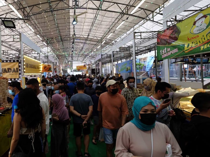 Visitors checking out food kiosks at the bazaar at Geylang Serai on Saturday (April 2), a day before it officially begins.