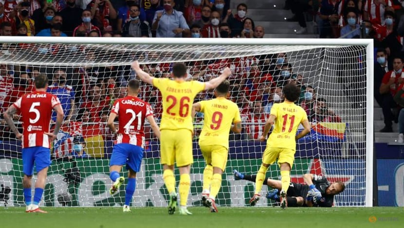Salah double helps Liverpool beat Atletico 3-2 as Griezmann sees red Salah double helps Liverpool beat Atletico 3-2 as Griezmann sees red