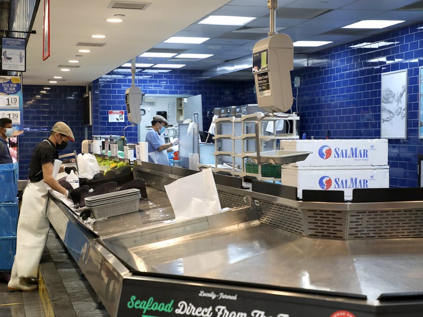 The seafood counter at NTUC Fairprice Xtra in Ang Mo Kio Hub was almost empty except for prawns, squids and a couple of varieties of fish at 5pm on July 18, 2021.