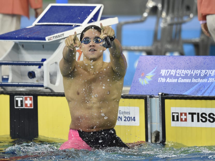 Singapore's Joseph Isaac Schooling celebrates winning the finals of the men's 100m butterfly swimming event during the 17th Asian Games at the Munhak Park Tae-hwan Aquatics Centre in Incheon on Sept 24, 2014. Photo: AFP