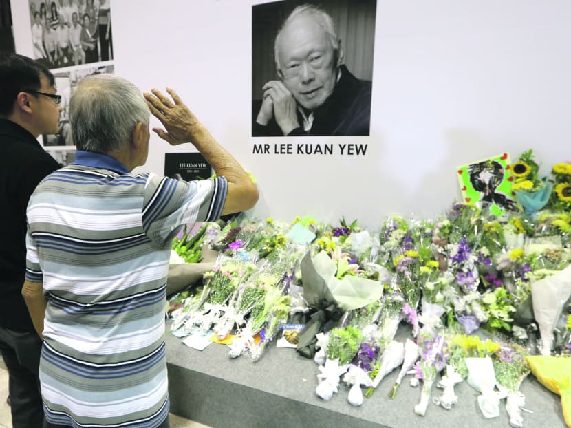 A man salutes while paying his respects to the late Mr Lee Kuan Yew at Tanjong Pagar Community Club on March 24, 2015. Photo: Ooi Boon Keong