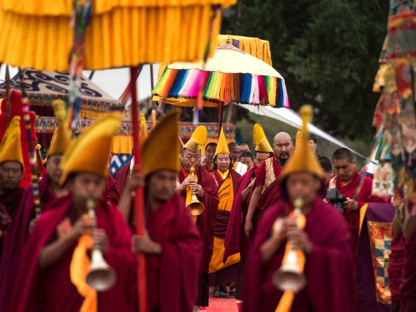 In this photo, Gyaltsen Norbu, the Chinese government-appointed 11th Panchen Lama (centre) is accompanied by Tibetan monks attend the Kalachakra ritual in Xigaze, south-west China's Tibet Autonomous Region. Photo: Xinhua via AP