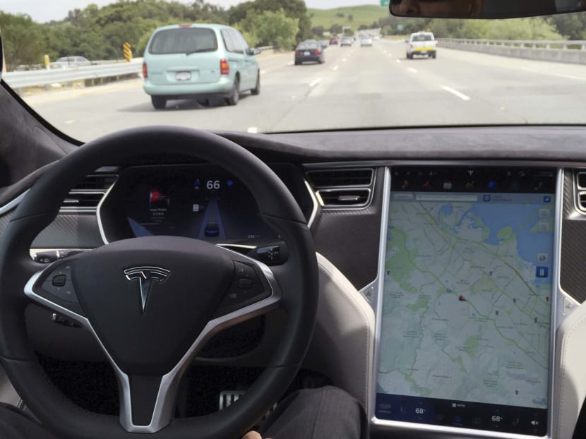 The interior of a Tesla Model S is shown in autopilot mode in San Francisco, California, on April 7, 2016.  Photo: Reuters