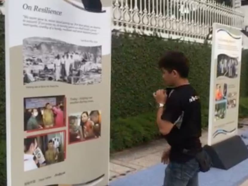 A worker putting up an exhibition panel for Remembering Mr Lee Kuan Yew on March 18, 2016. Photo: Jason Quah/TODAY