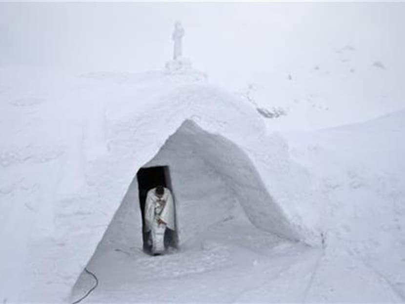 Romanian mountain Ice Church draws all types of Christians