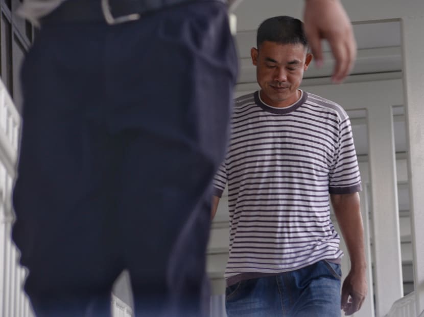 Wang Jianpo, 39, who left a luggage unattended at Hougang MRT station and sparked a security scare, has pleaded guilty to one count of causing public nuisance on Wednesday (May 17). Photo: Robin Choo/TODAY