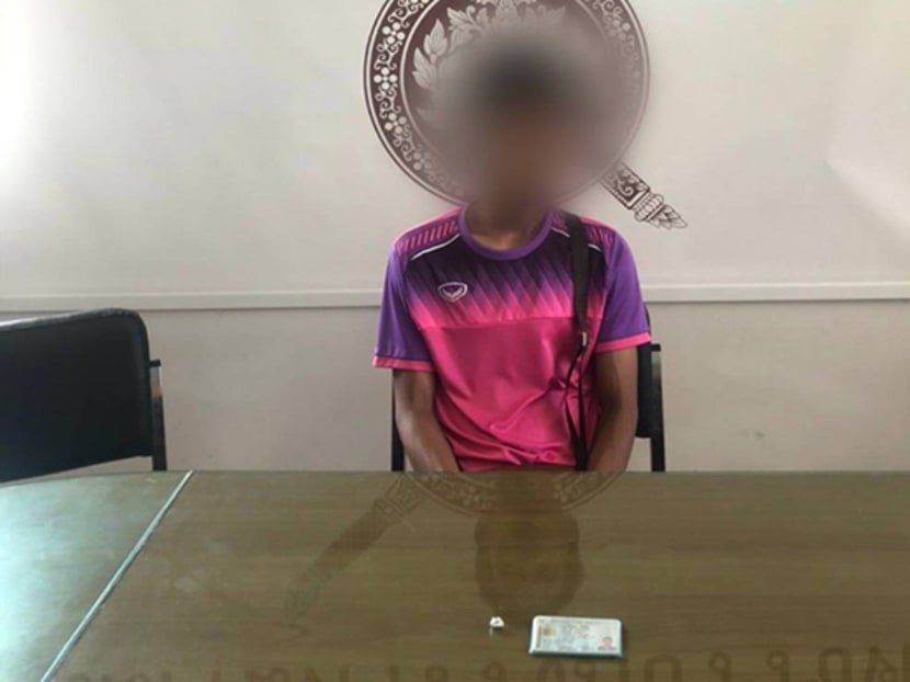 Chayaphol Addin is seen with a single "ya ba" pill at Wichit police station in Muang district of Phuket on Saturday (April 11). He asked to be arrested in order to get food. Police blurred his identity.