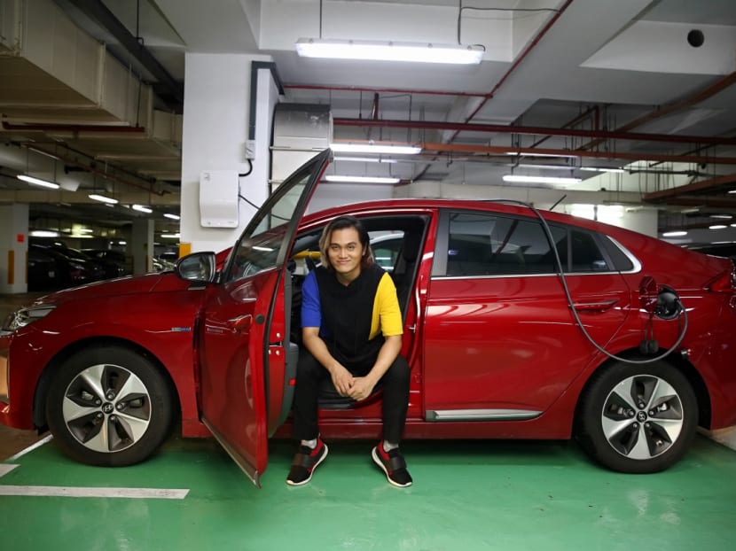 Mr Peter Huang, 35, bought his Hyundai Ioniq at the start of the year. He is among a small group of electric car owners in Singapore who are the "early adopters" of such vehicles. Photo: Nuria Ling/TODAY