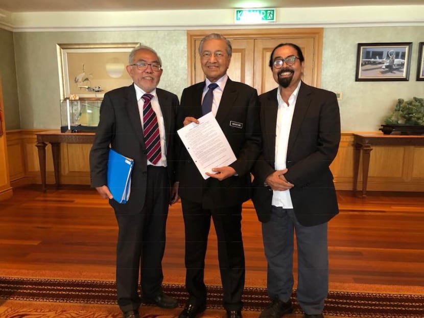 Former political dissident Tan Wah Piow (L) and Malaysian activist Hishammuddin Rais pose for a picture with Malaysian PM Mahathir Mohammad on Aug 30, 2018. Former political dissident Tan Wah Piow (L) and Malaysian activist Hishammuddin Rais pose for a picture with Malaysian PM Mahathir Mohammad on Aug 30, 2018.