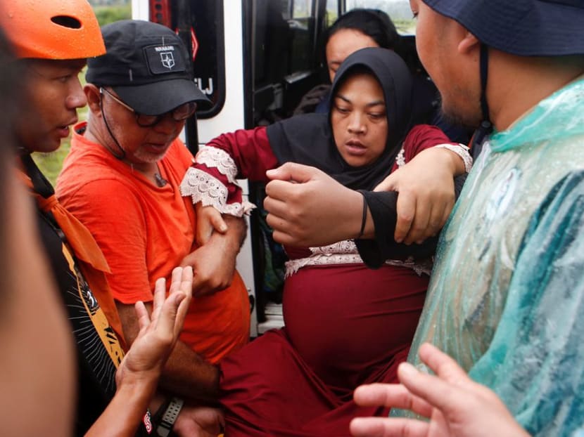 Ms Rohmat Kartini, 35, a pregnant woman, is evacuated to a relief centre after an earthquake hit Sukamulya, in Cianjur, West Java Province, Indonesia, Nov 23, 2022. 