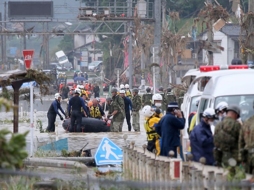 Residents are evacuated from flood-affected area by rubber boats in Kuma village, Kumamoto prefecture, on July 5, 2020.