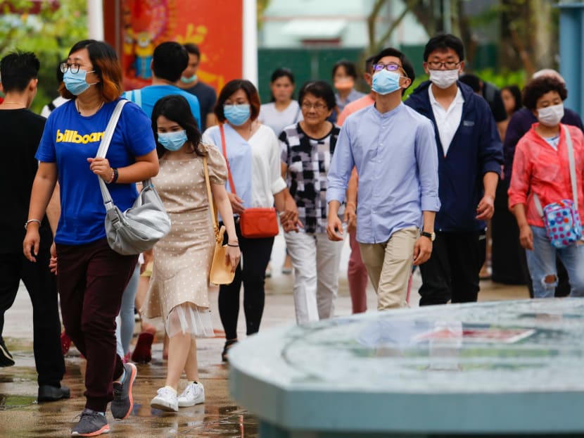 Tourists on Sentosa wearing masks on Wednesday (Jan 29) as the number of Wuhan coronavirus cases grew.