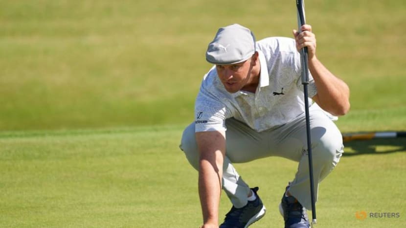Golf-DeChambeau plays pantomime villain but survives cut Golf-DeChambeau plays pantomime villain but survives cut