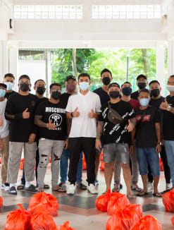 A group of volunteers, including ex-convicts, during a charity event at North Bridge Road on April 17, 2022.