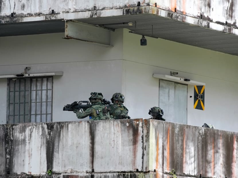 Soldiers securing a building during Exercise Tiger Balm on Wednesday, July 17, 2019.