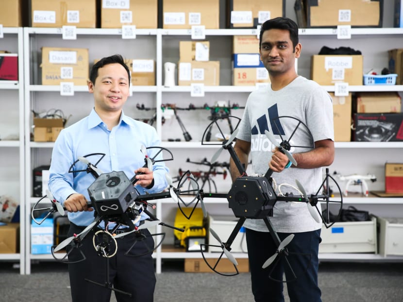 Infinium Robotics's CEO Woon Junyang (L) and flight control engineer Siddharth Patel.