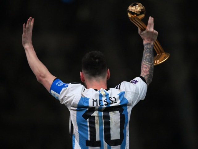 Argentina's forward Lionel Messi gestures after receiving the Golden Ball award during the Qatar 2022 World Cup trophy ceremony after the football final match between Argentina and France at Lusail Stadium in Lusail, north of Doha on Dec 18, 2022.

