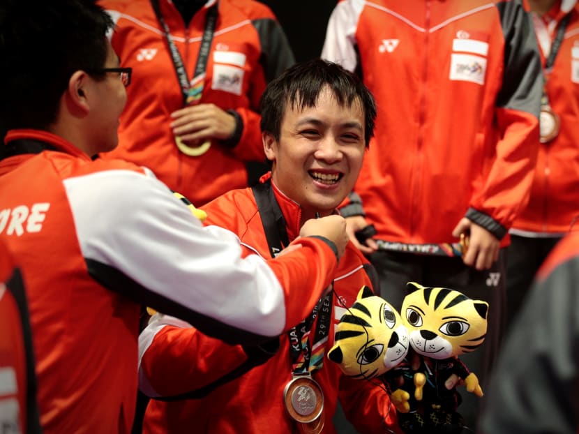 Pang Xuejie cried tears of joy and relief after winning the men's doubles gold medal with Gao Ning on Sunday night. Photos: Jason Quah/TODAY; Sport Singapore/Ben Cho