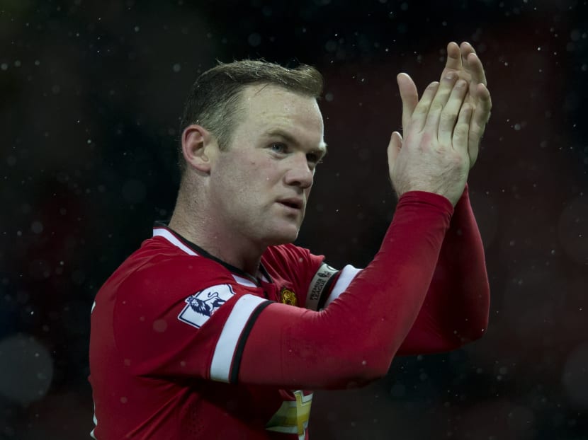 Manchester United's Wayne Rooney applauds supporters after the English Premier League soccer match between Manchester United and Newcastle. Photo: AP