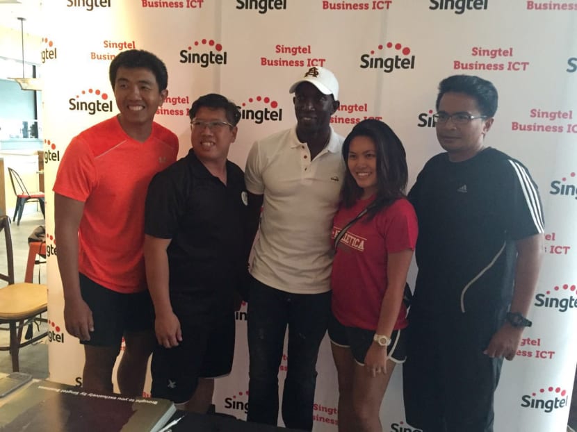 Former Manchester United striker Dwight Yorke (centre), meeting fans in Singapore at a Singtel event. He says the United players must take the blame for the team’s disappointing season, as well as coach Louis van Gaal. Photo: Singtel