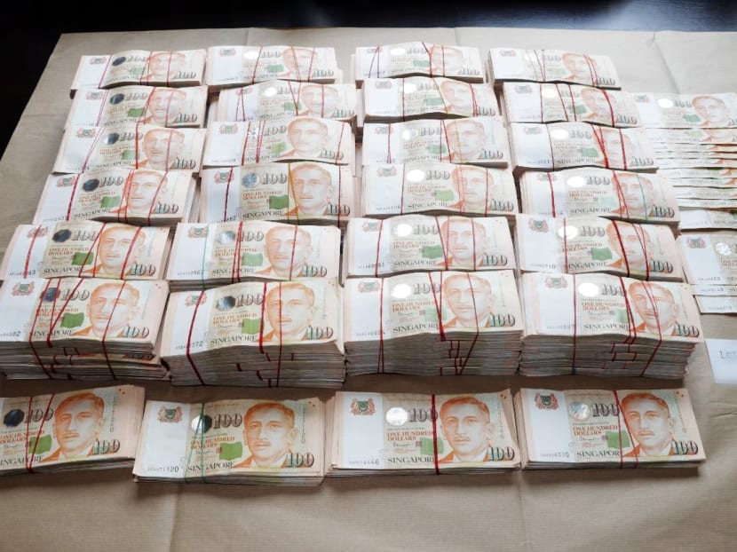 Cash seized by the police. Cash seized by the police.