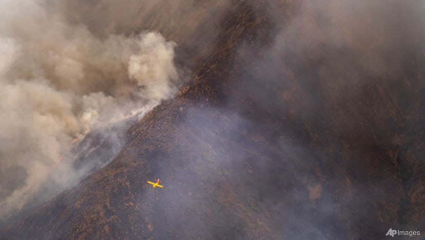 Rainfall helps firefighters control southern Spain's inferno Rainfall helps firefighters control southern Spain's inferno