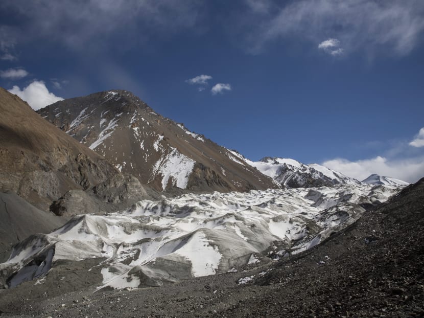 The Mengke Glacier in Subei County in China's Gansu province is receding fast, and towns along an arid corridor have suffered floods and landslides caused by sudden rainstorms.  The author says the best long-term investment against climate change is in green energy research and development.  Photo: The New York Times