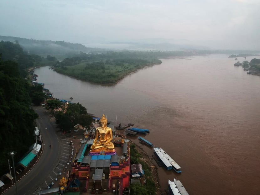 This photo taken on Sept 20, 2019 shows a giant Buddha on the Thai side of the Golden Triangle in Chiang Rai province, with Myanmar in the background and Laos on the right.