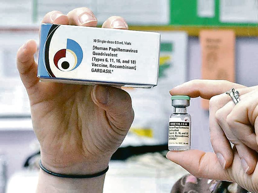 A child health nurse with a vial and box for the HPV vaccine. AP file photo