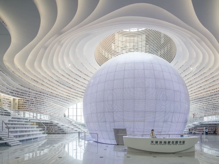 The pure white Tianjin Binhai Library opened in Oct 2017 and features a spherical auditorium nicknamed "the eye" in the middle of the space.