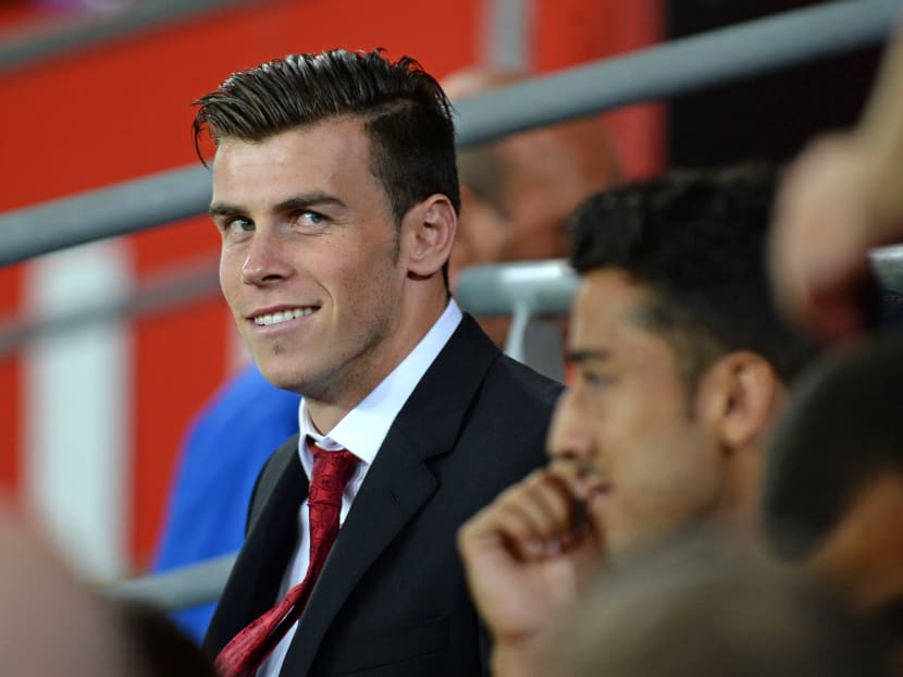 Tottenham’s Welsh international Gareth Bale sits on the subs bench during the international friendly between Wales and Ireland at the Cardiff City Stadium on Aug 14, 2013 in Cardiff, Wales. Photo: Getty Images