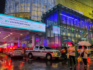 People flee following shots fired at the luxury Siam Paragon shopping mall, in Bangkok, Thailand, on Oct 3, 2023.