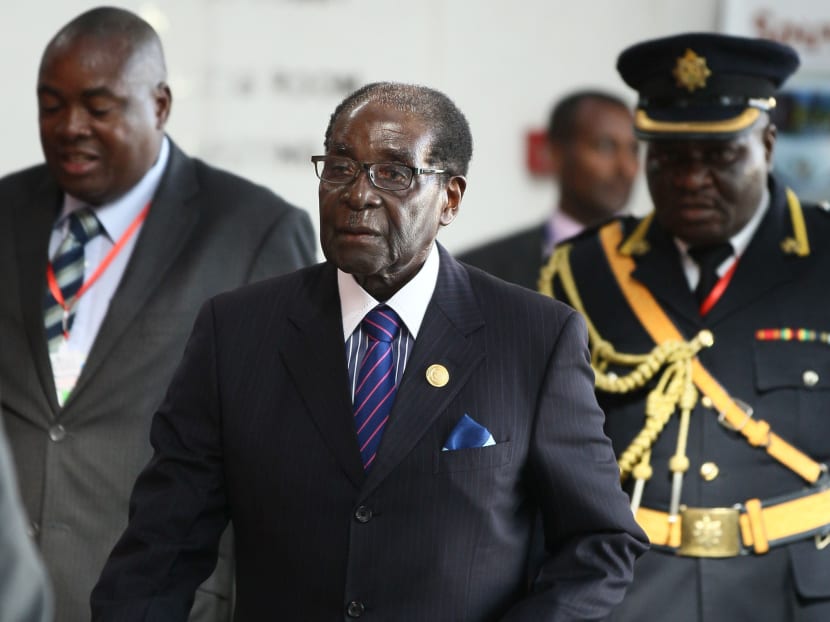 Zimbabwe's President Robert Mugabe (C) arrives for the 24th Ordinary session of the Assembly of Heads of State and Government of the African Union (AU) at the African Union headquarters in Ethiopia's capital Addis Ababa, January 31, 2015. Photo: Reuters