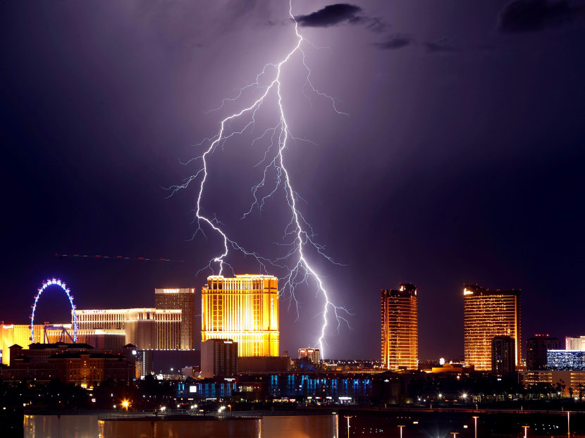 Lightning strikes behind Las Vegas Strip casinos as a thunderstorm passes through Las Vegas, Nevada, US. Photo: Reuters
