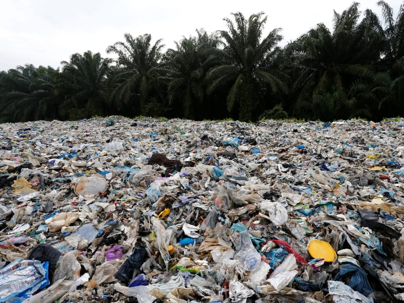 Plastic waste piled outside an illegal recycling factory in Jenjarom, Kuala Langat, Malaysia. The author says that while a life without plastics may seem unimaginable, its worth remembering that their prevalence is a relativity recent phenomenon.