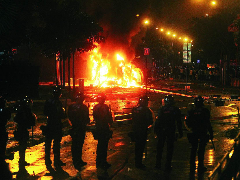 At least five emergency vehicles were set alight during the Little India riot last year. TODAY FILE PHOTO